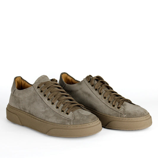 Taupe low-top lace-up sneakers with stitched panels and platform soles
