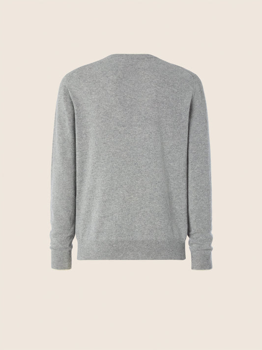 Gray crew neck knit sweater with long sleeves and ribbed trims