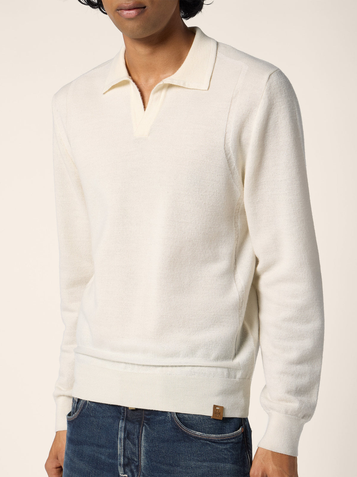Men's cream long-sleeve polo sweater with folded collar and ribbed cuffs