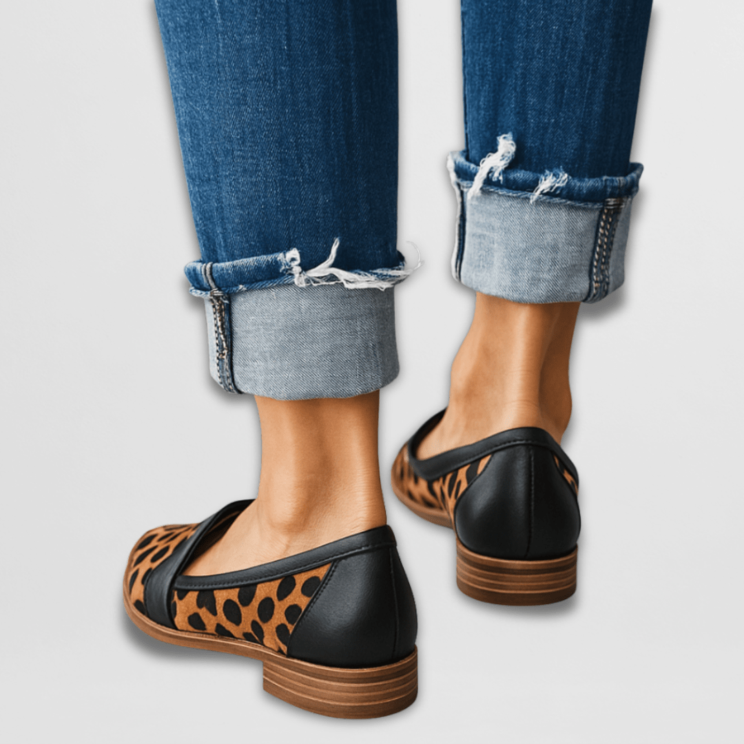 Women's pointed penny loafers with low heels and slip-on styling