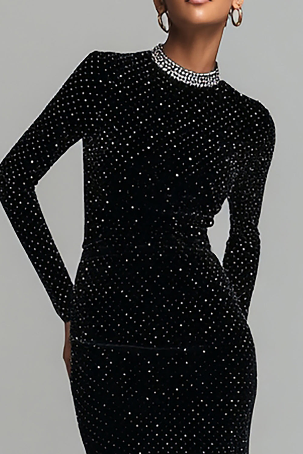 Women's black sparkly long-sleeve maxi dress with round neckline and embellished trim