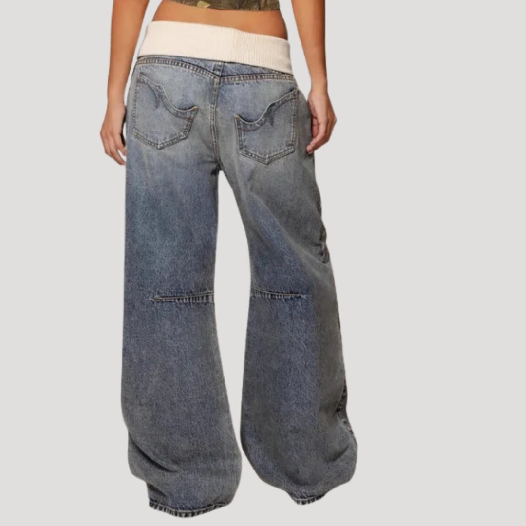 Women's blue low-rise wide-leg jeans with curved panel detailing