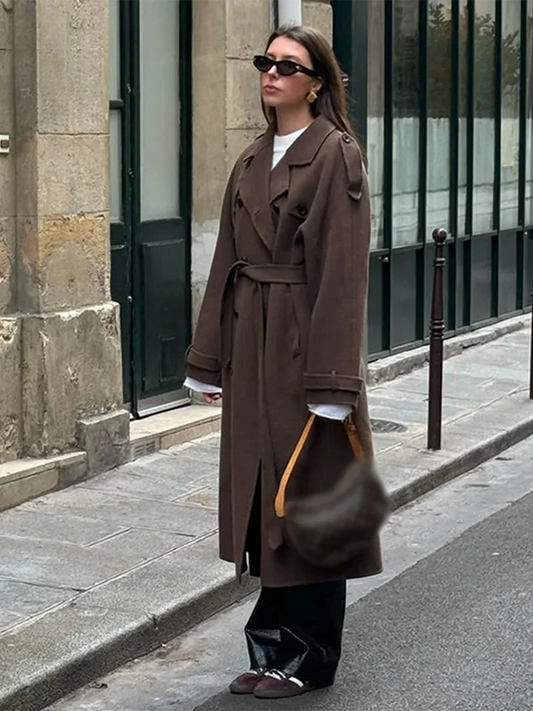 Women's long double-breasted trench coat with lapels, buttons and belt