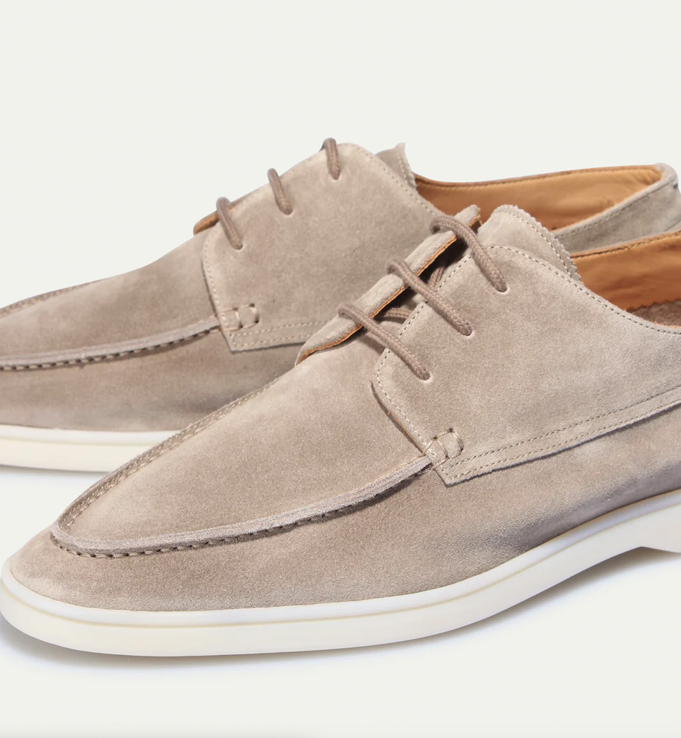 Men's lace-up moc toe loafers shown in navy blue and beige with light soles