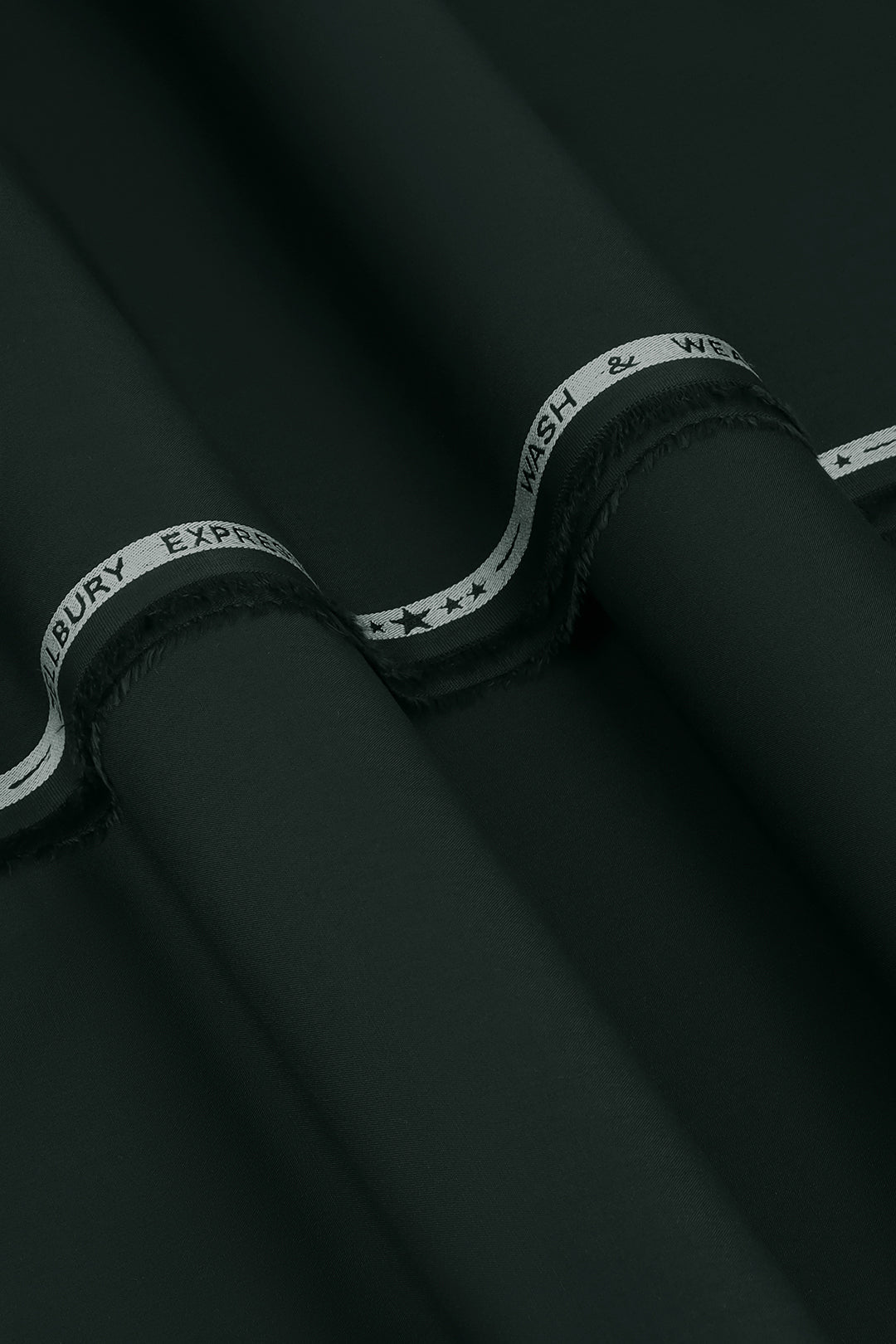 Close-up of smooth suit fabric with branded trim