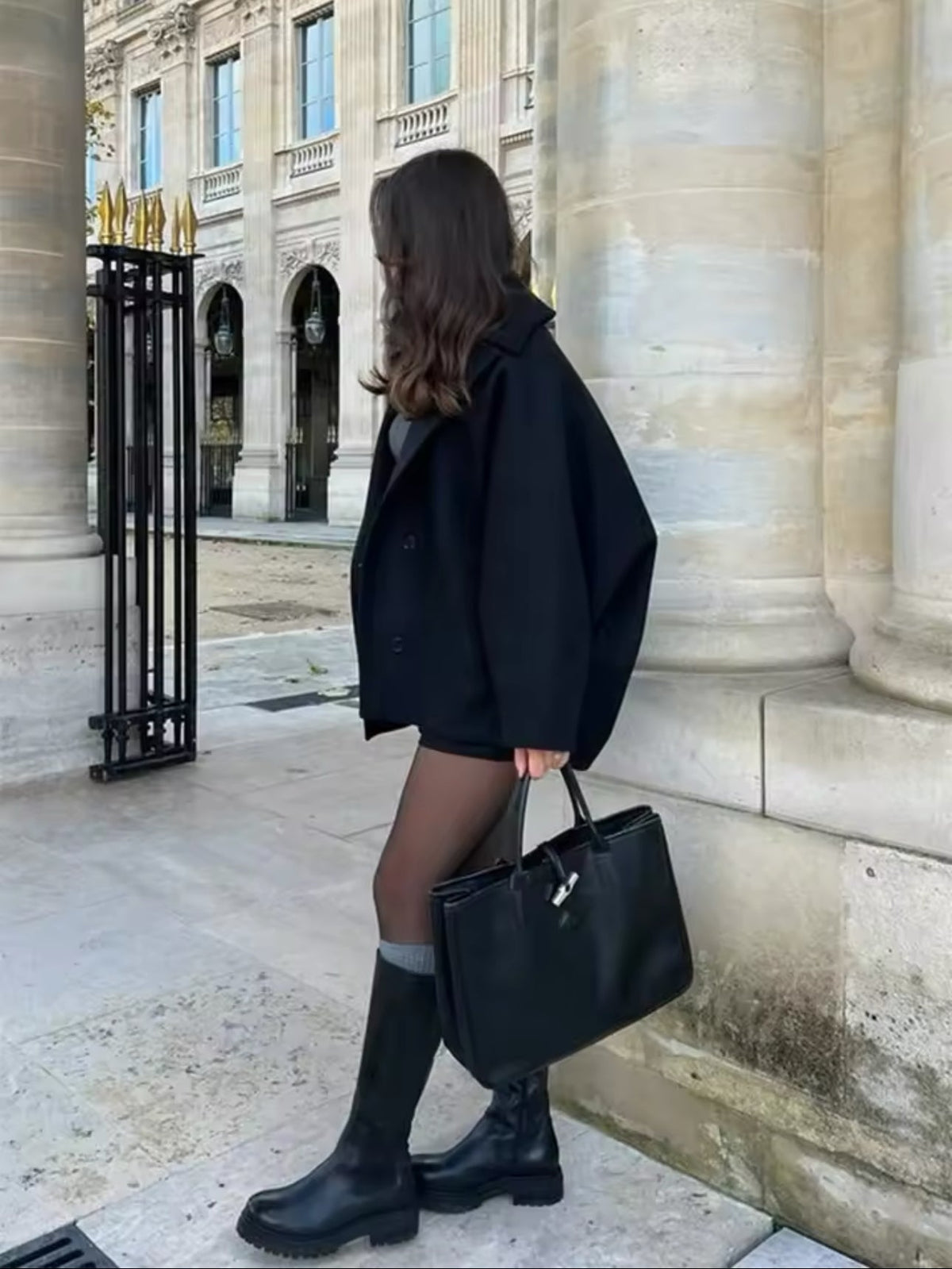 Women's oversized coat with point collar, button front and two welt pockets