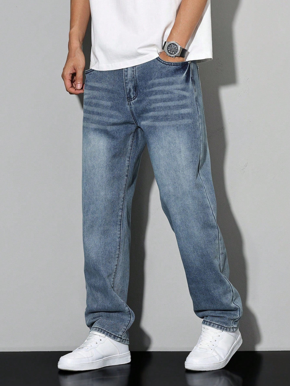 Men's straight leg jeans with a mid-rise waist and full-length legs