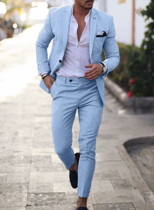Men's textured two piece suit with notched lapel blazer and tapered trousers