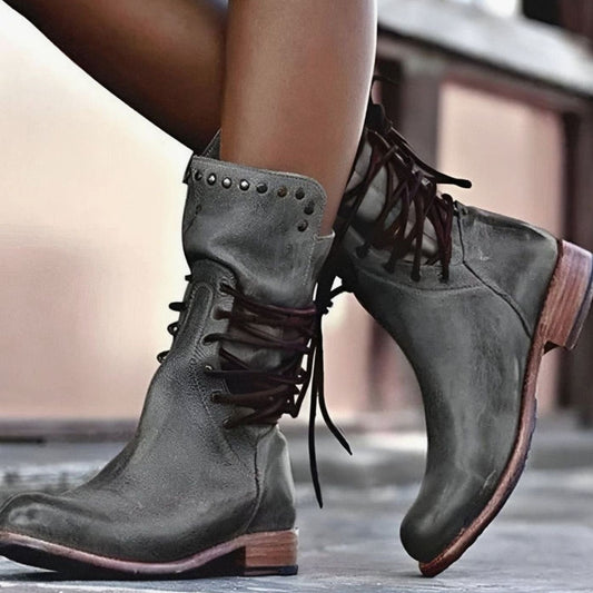 Women's lace-up ankle boots with studded ankle trim and low heels