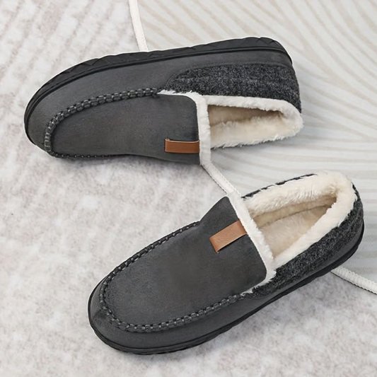 Men's slip-on moc toe slippers with plush lining and flat textured soles