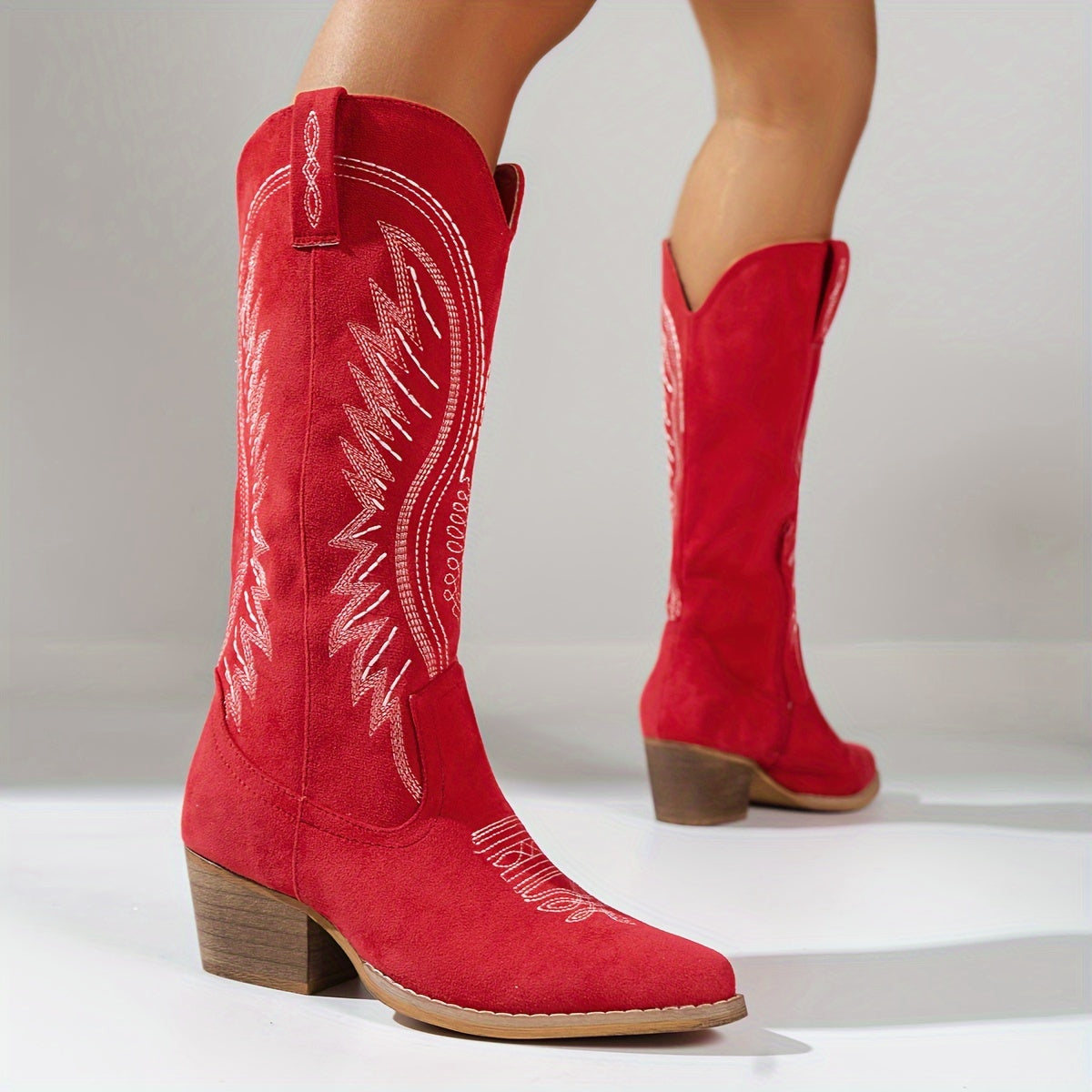 Women's knee-high western boots with embroidered detailing and block heels
