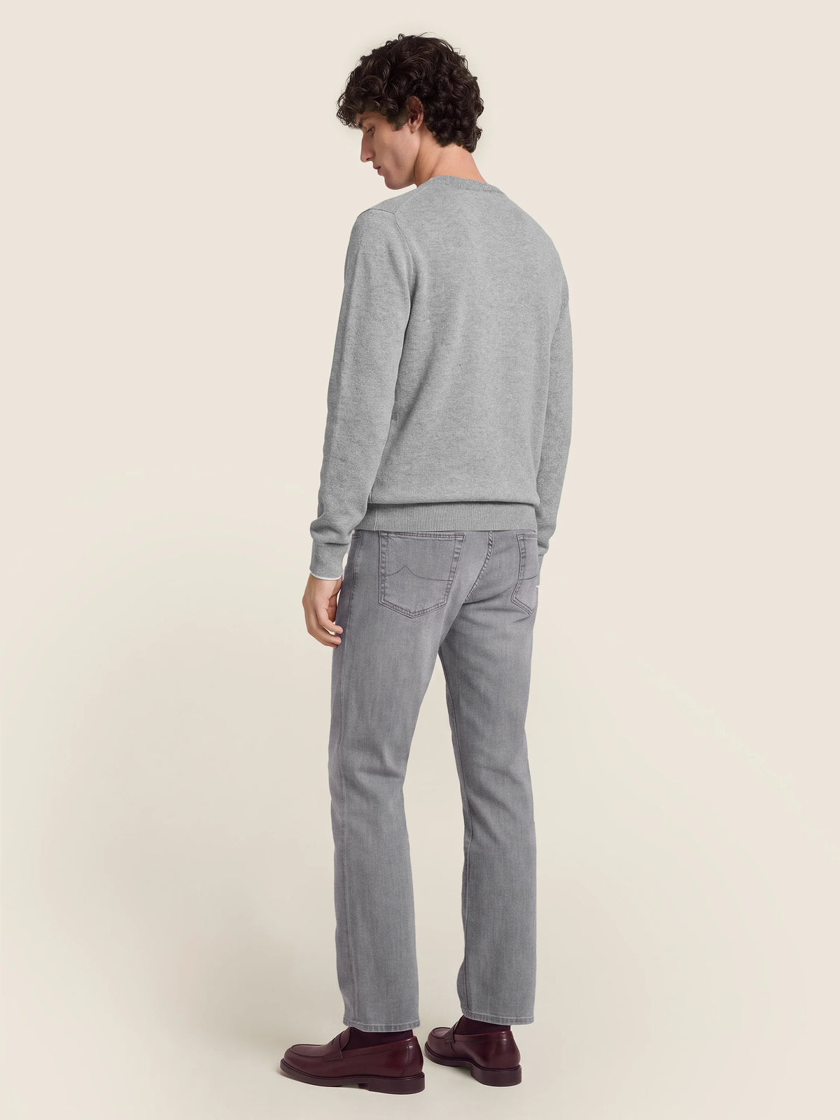 Gray crew neck knit sweater with long sleeves and ribbed trims