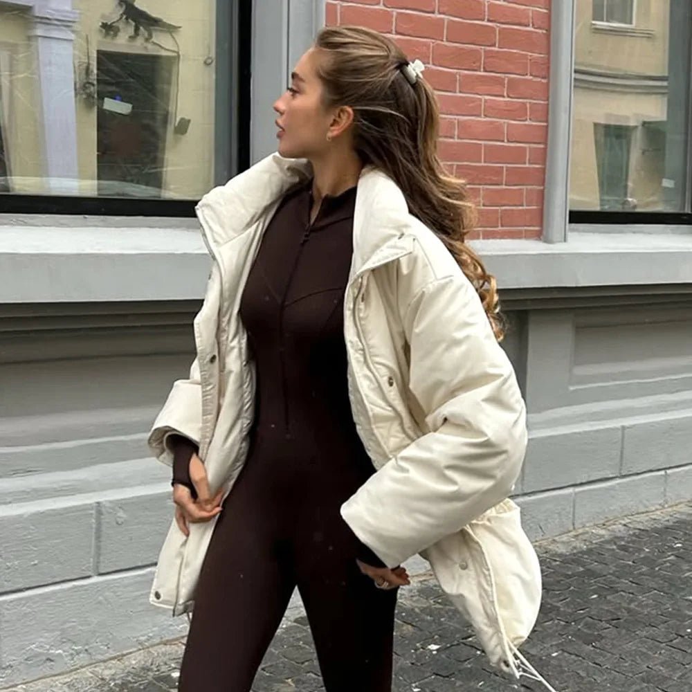 Women's beige padded puffer coat with stand collar, long sleeves and flap pockets
