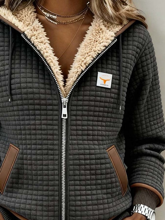 Women's gray quilted hooded jacket with sherpa-style lining and front zipper