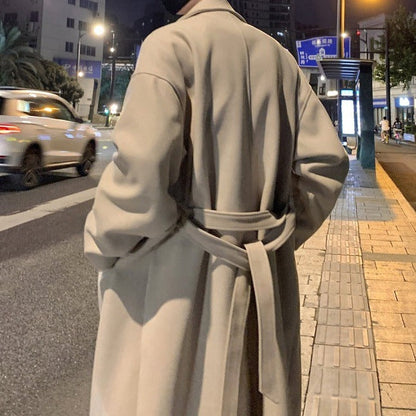 Men's long belted overcoat with notched lapels and side pockets