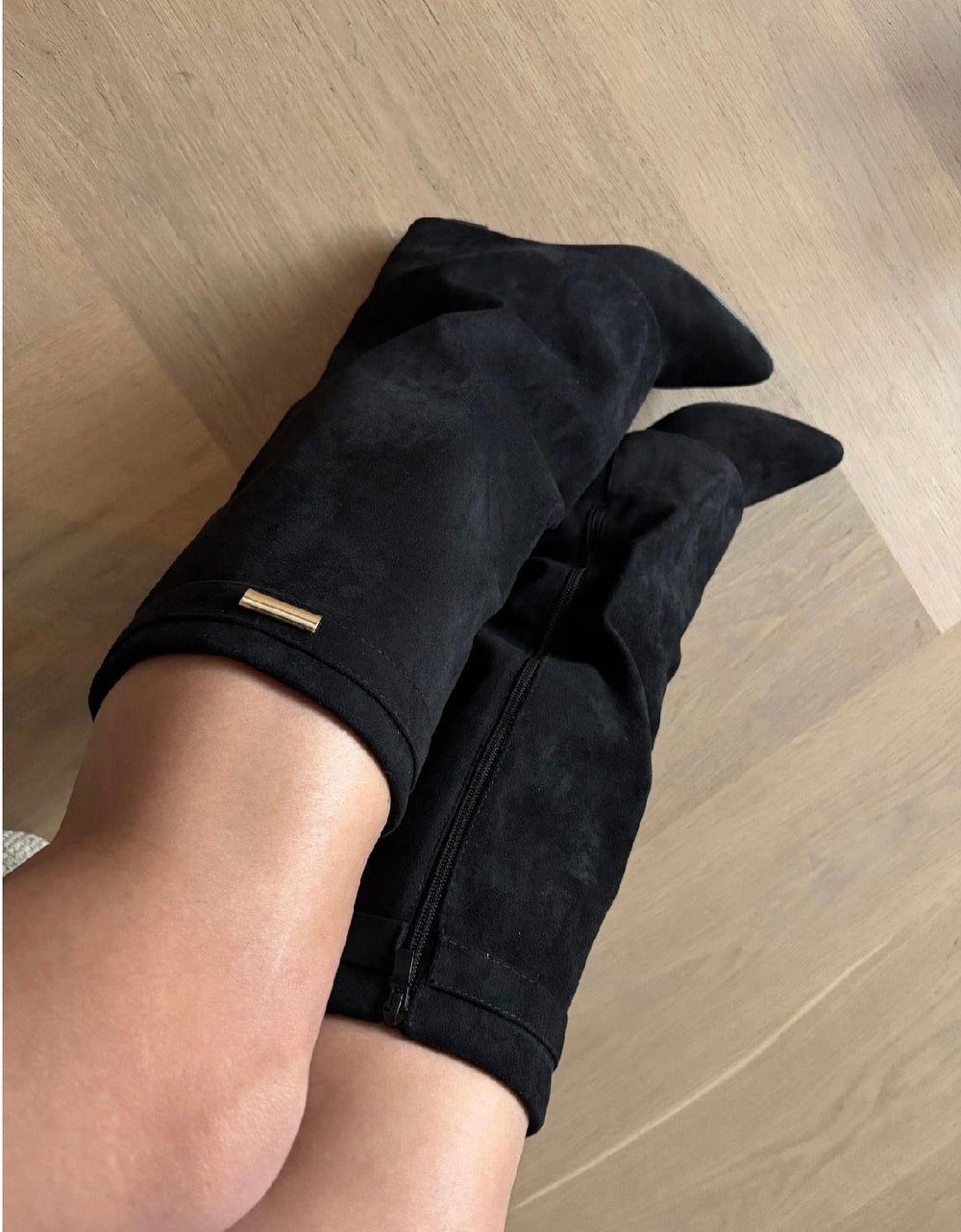 Women's black knee high boots with pointed toe and wedge heel