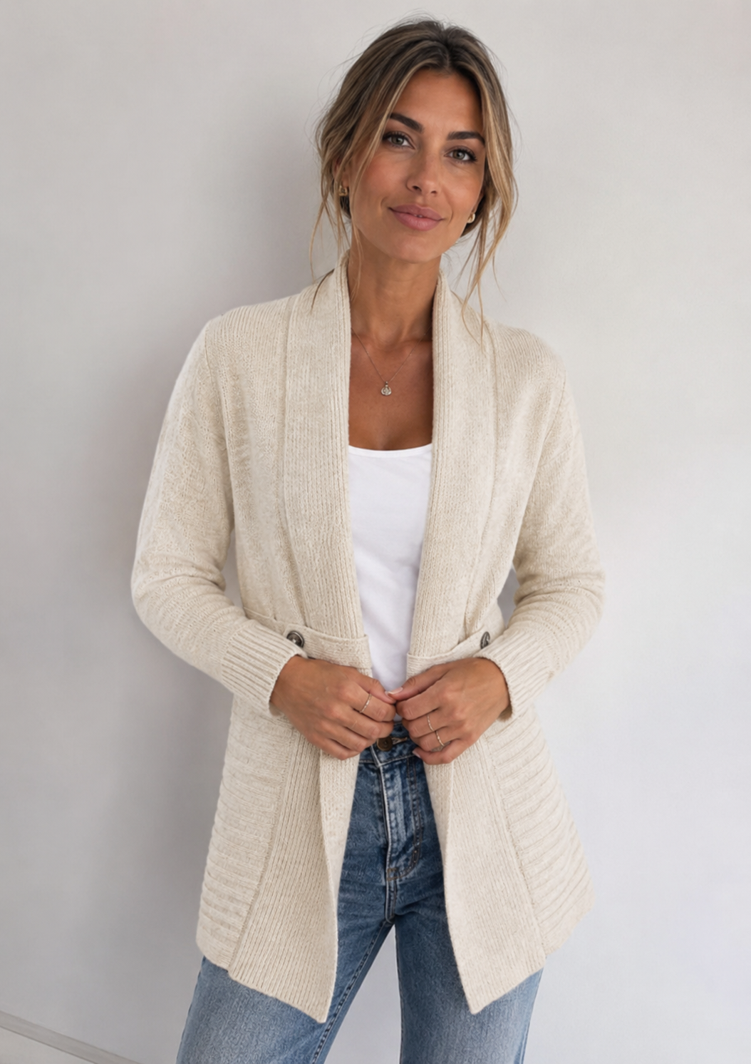 Women's long textured cardigan with open front, long sleeves and buttoned pocket tabs