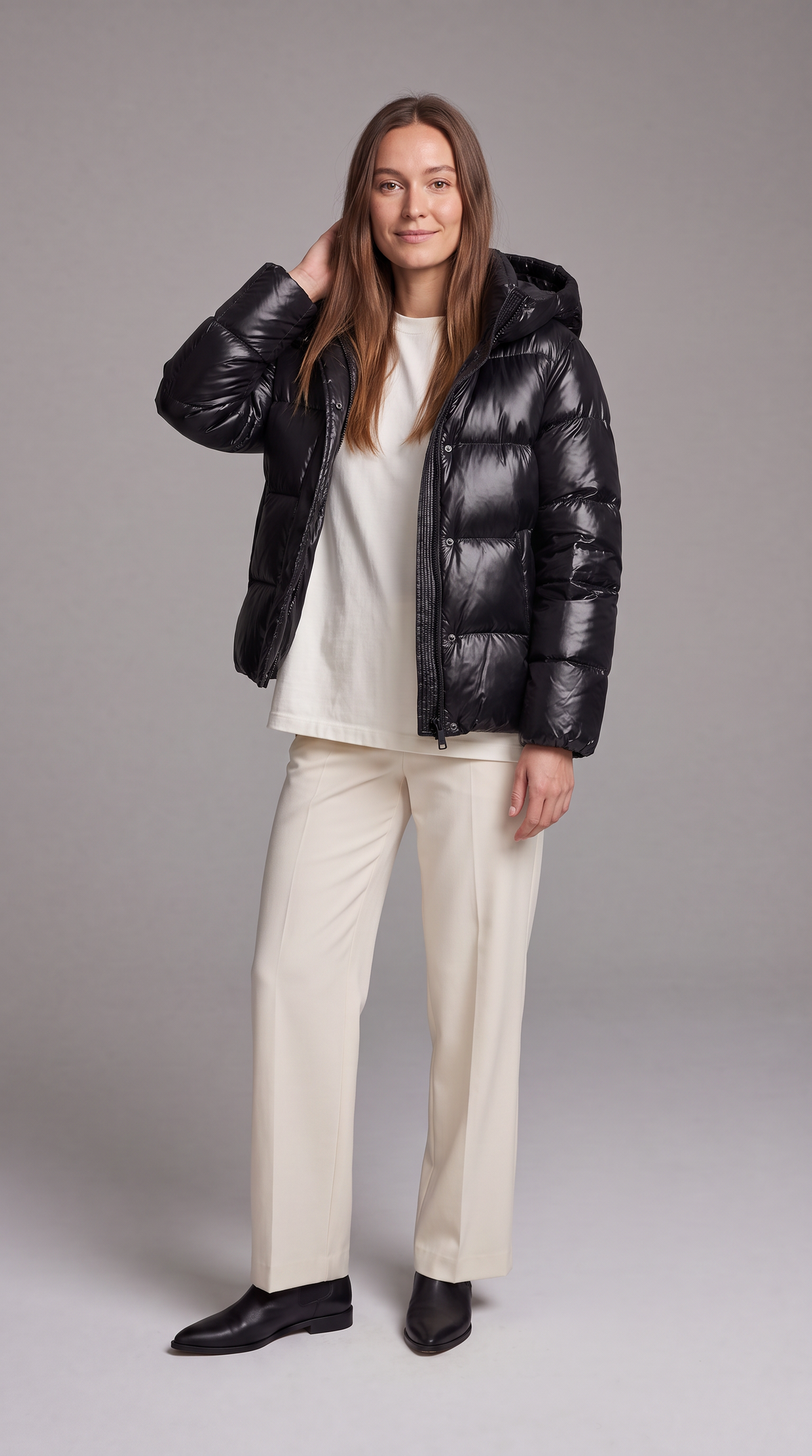 Women's hooded quilted puffer coat with long sleeves and zip front