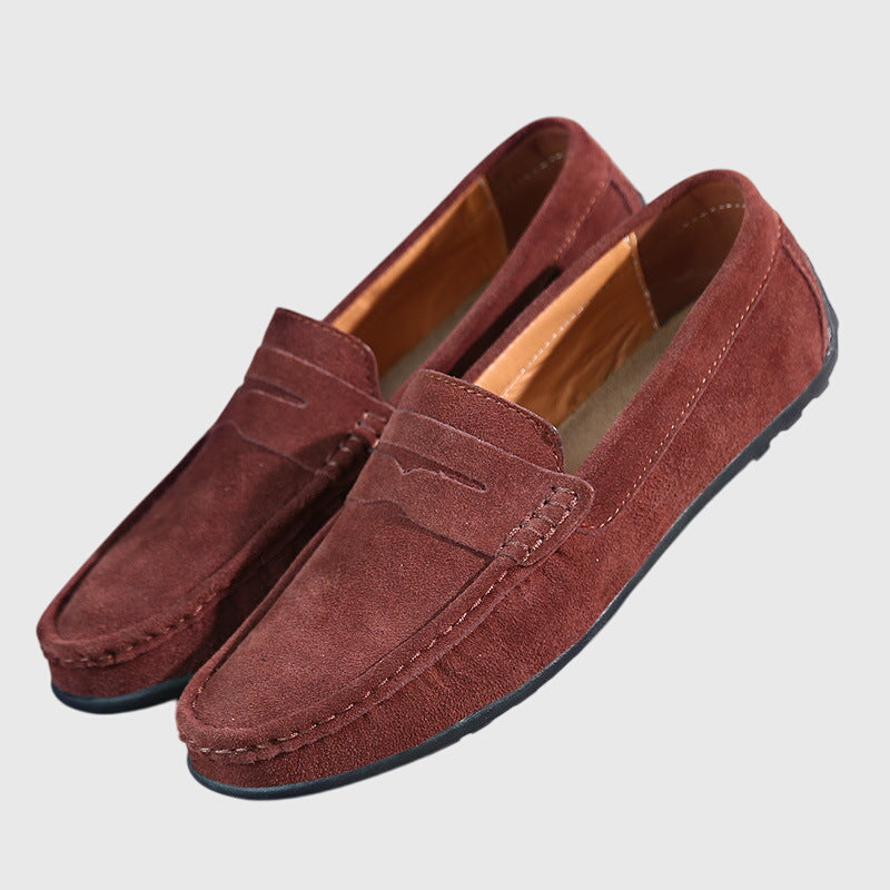 Classic slip-on loafers with penny strap and moc-toe stitching