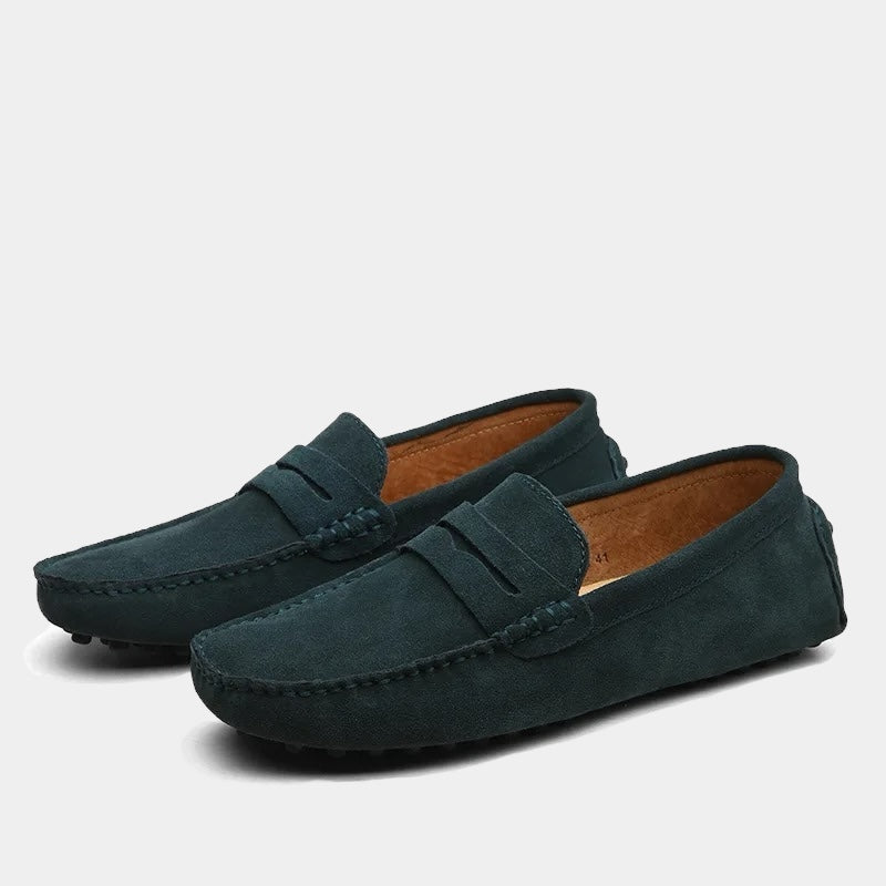 Pair of men's slip-on loafers with moc toe stitching and penny strap detail
