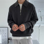 Men's quarter zip rib knit sweater with collared neckline and long sleeves