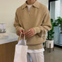 Men's quarter zip rib knit sweater with collared neckline and long sleeves