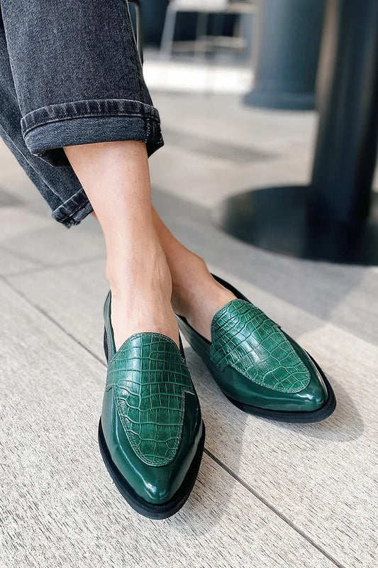 Green crocodile-print pointed-toe loafers with flat soles