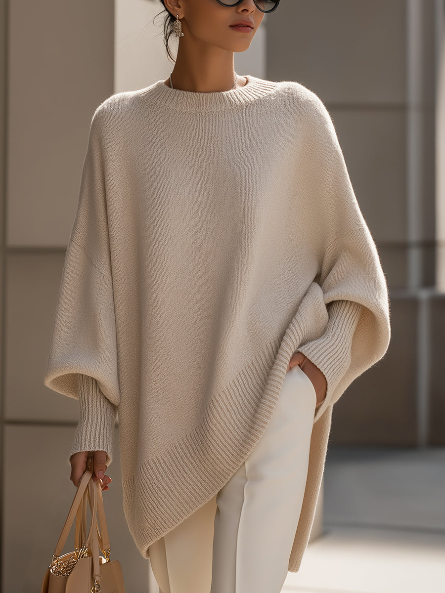 Women's oversized knit sweater with crew neck and asymmetric longline hem