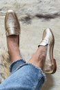 Women's gold metallic round-toe loafers with layered vamp detail