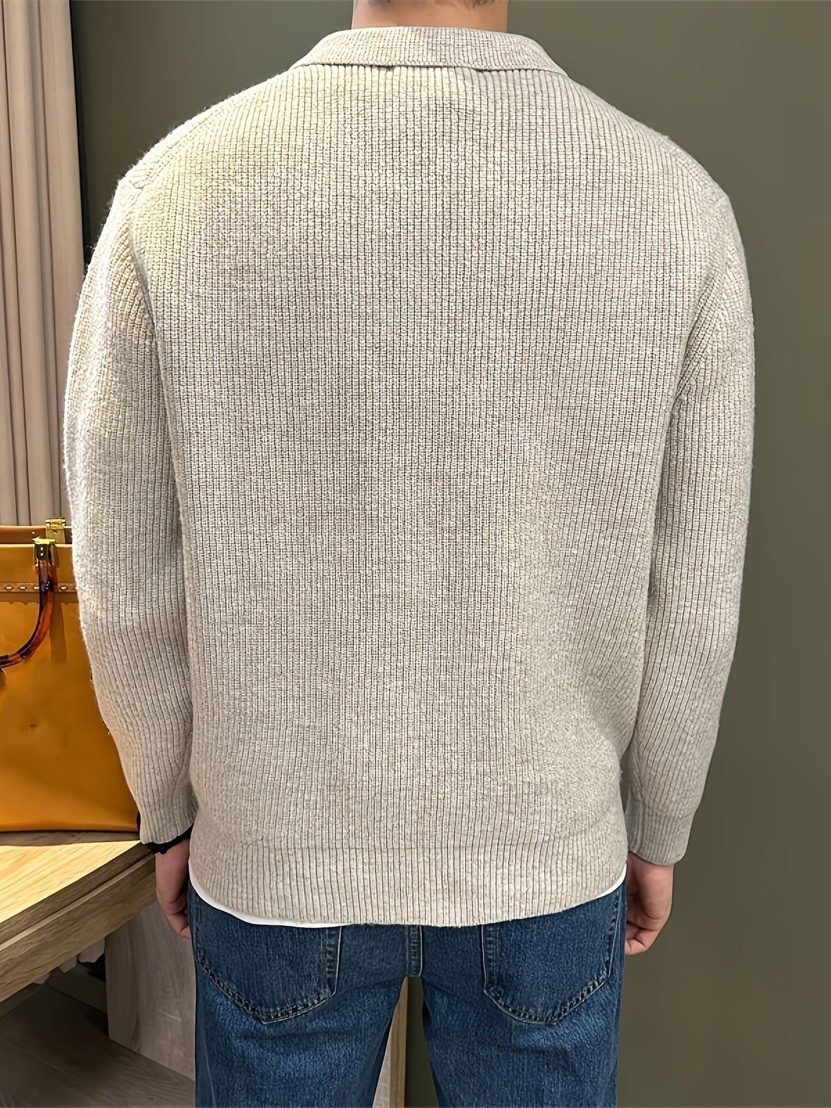 Men's ribbed knit polo sweater with point collar and long sleeves