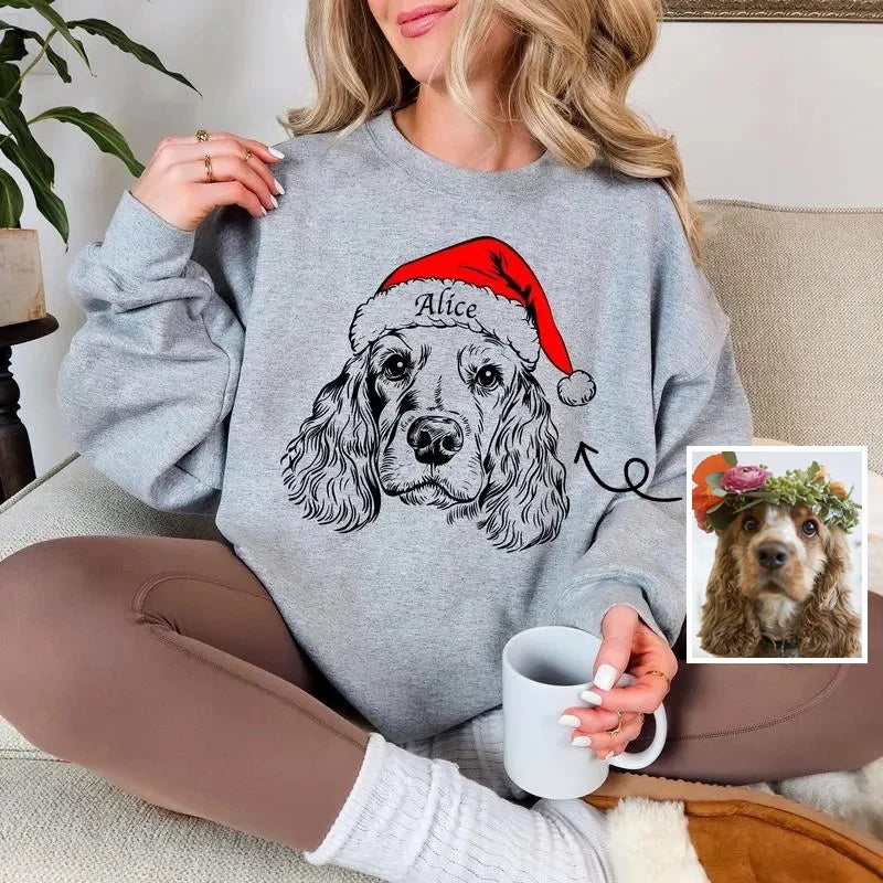 Unisex grey Christmas sweatshirt with dog Santa hat design, shown on family members around decorated kitchen