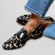 Women's animal print loafers with black trim