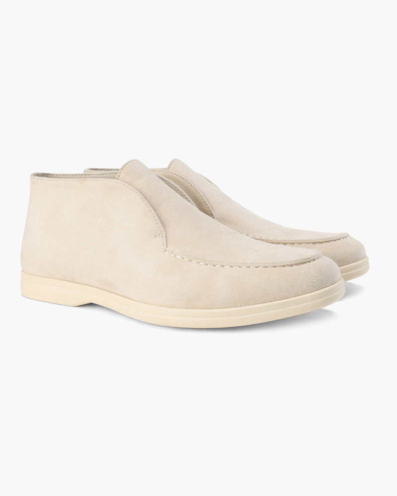 Ankle-height slip-on loafers with rounded toes, stitched apron detailing and flat contrasting soles