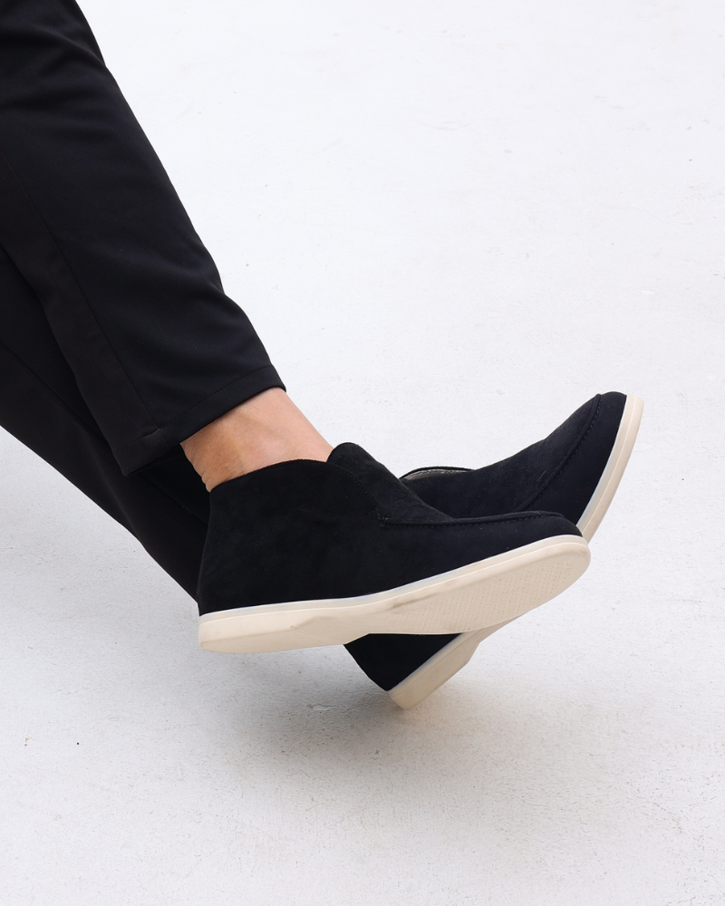 Ankle-height slip-on loafers with rounded toes, stitched apron detailing and flat contrasting soles