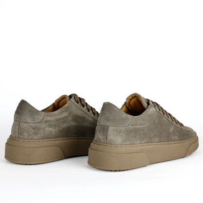 Taupe low-top lace-up sneakers with stitched panels and platform soles