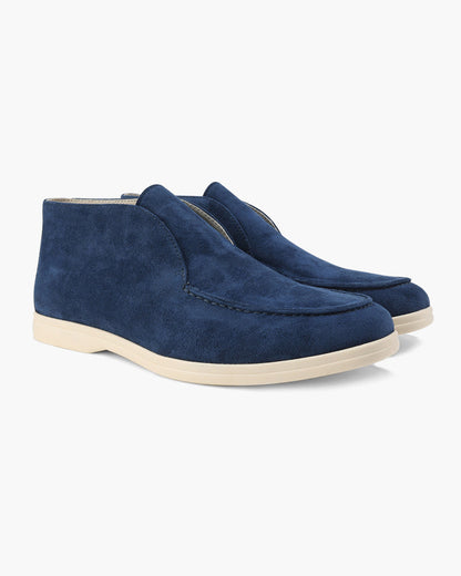 Ankle-height slip-on loafers with rounded toes, stitched apron detailing and flat contrasting soles