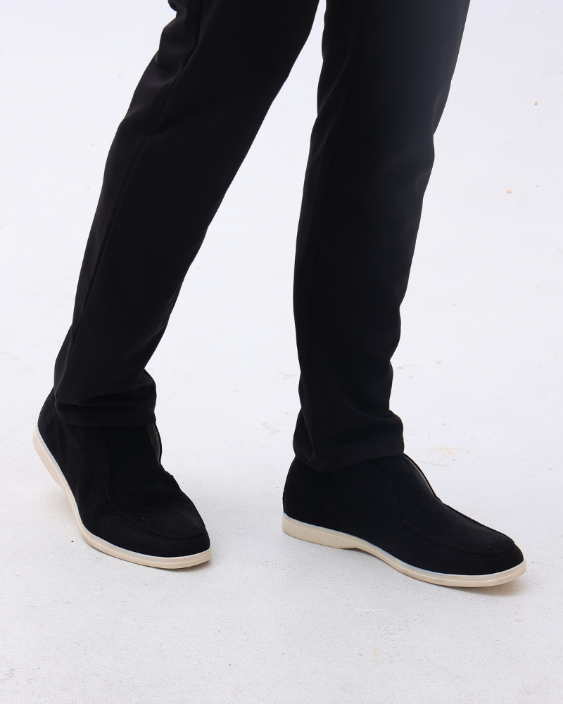 Ankle-height slip-on loafers with rounded toes, stitched apron detailing and flat contrasting soles