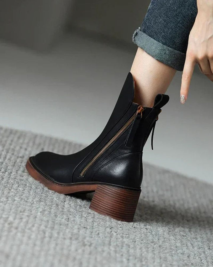 Women's heeled ankle boots with side zippers and tassel details
