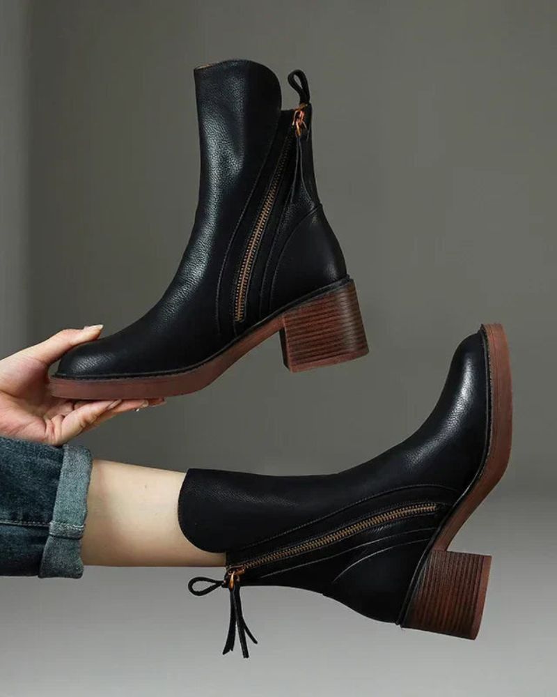 Women's heeled ankle boots with side zippers and tassel details
