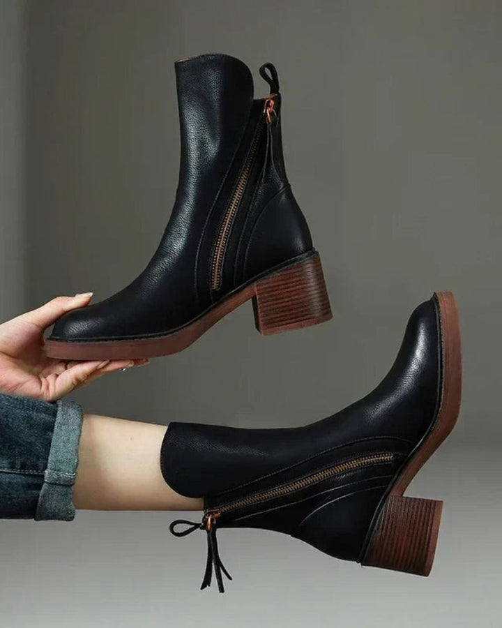 Women's heeled ankle boots with side zippers and tassel details