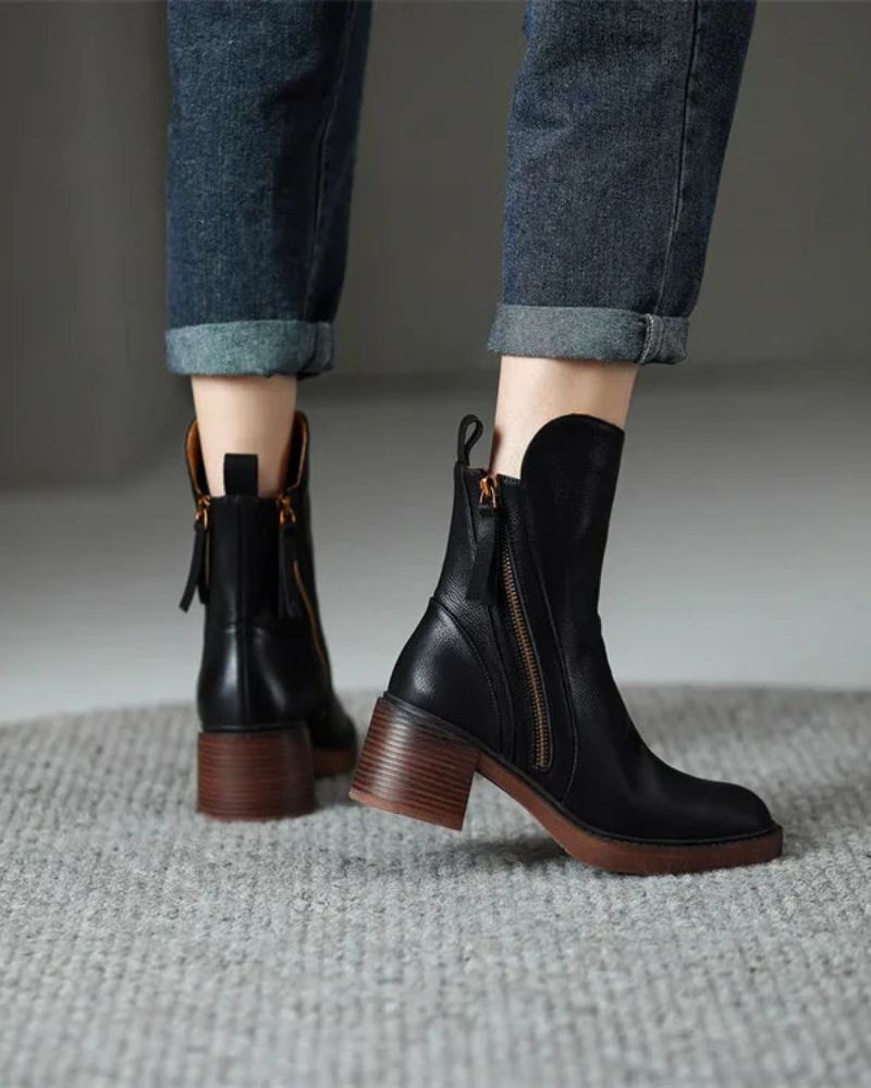 Women's heeled ankle boots with side zippers and tassel details