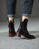 Women's heeled ankle boots with side zippers and tassel details
