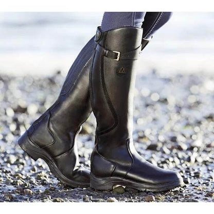 Women's tall riding boots with buckle straps, rounded toes and low heels