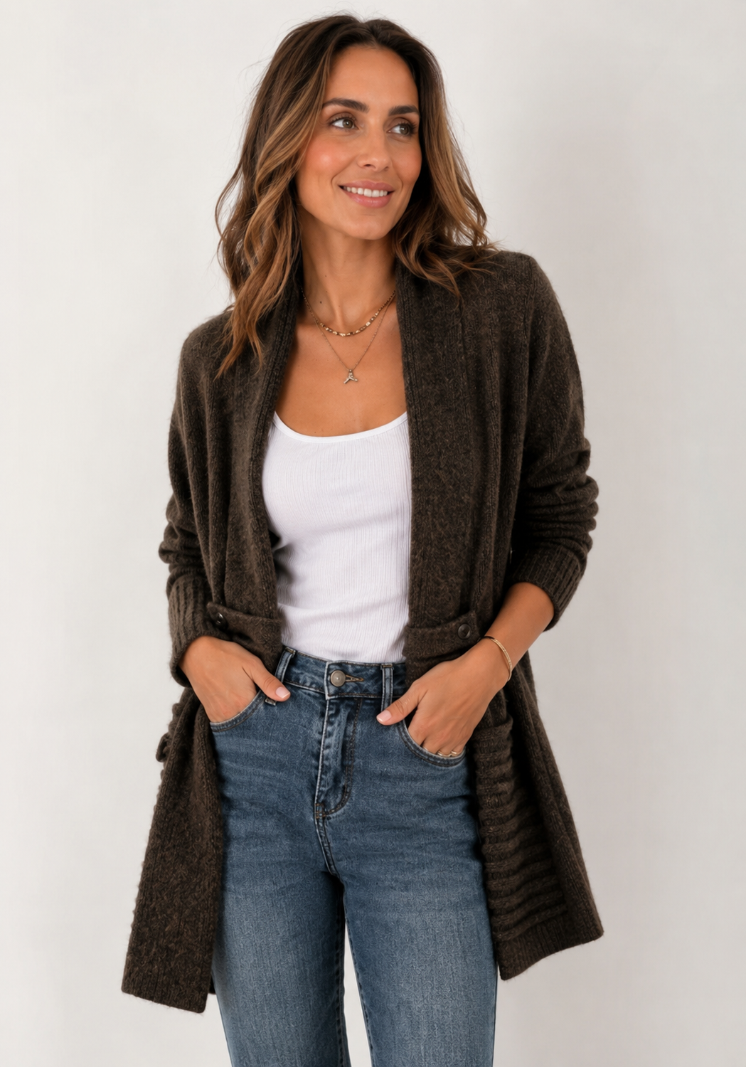 Women's long textured cardigan with open front, long sleeves and buttoned pocket tabs