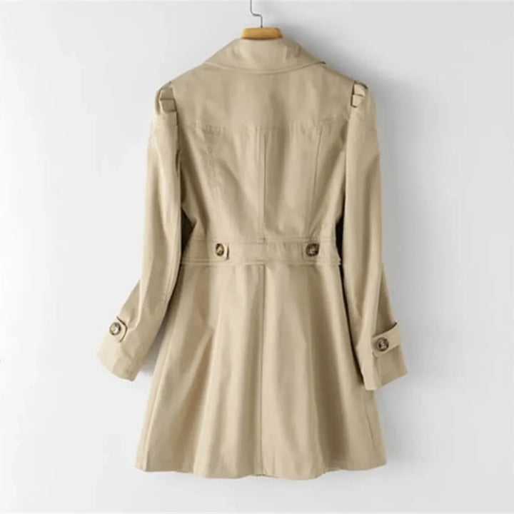 Women's belted double breasted trench coat with long sleeves and flap pockets
