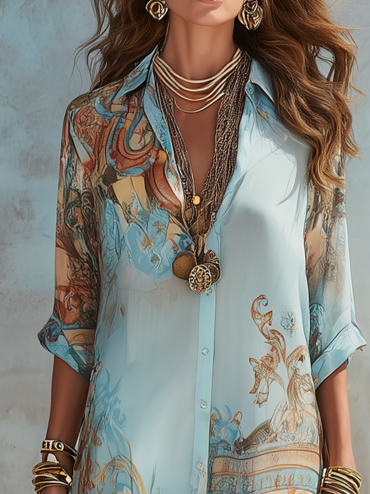 Woman wearing a floor-length printed shirt dress with a button front, collar, rolled sleeves and a front slit