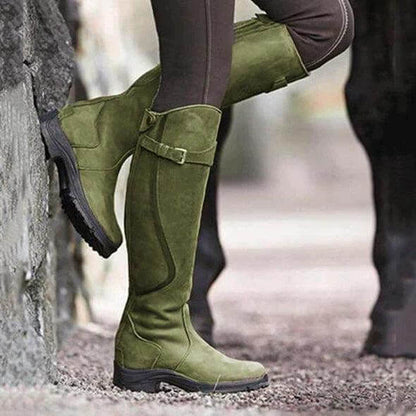 Women's tall riding boots with buckle straps, rounded toes and low heels