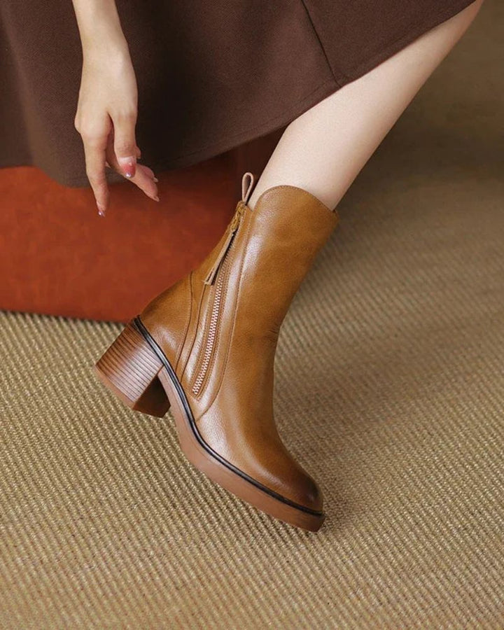 Women's heeled ankle boots with side zippers and tassel details