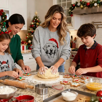 Unisex grey Christmas sweatshirt with dog Santa hat design, shown on family members around decorated kitchen