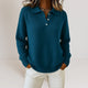Women's collared knit sweater with button placket and long sleeves